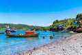 Boat on the shore of the lake in Puerto Montt, Chile. Copy space for text