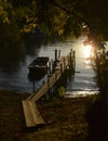 A boat on the shore of a river Danube at sunset. Royalty Free Stock Photo