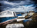 Boat on the shore under a stormy sky