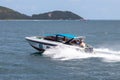 A boat shuttles tourists to Koh Larn, a popular beach in Chon Buri province