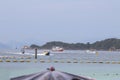 A boat shuttles tourists to Koh Larn, a popular beach in Chon Buri province