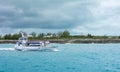 Boat shuttling tourists to Coco Cay Bahamas private tropical is