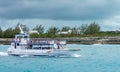 Boat shuttling tourists to Coco Cay Bahamas private tropical is