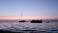 Boat silhoette at dawn in Ria Formosa. Algarve