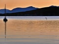 Boat silhouetted, stunning sunset and hills beyond, Oban, Scotland Royalty Free Stock Photo