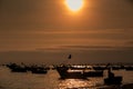 Boat Silhouettes in Ocean at Sunset and Sun Disk in Sky Royalty Free Stock Photo