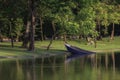 A Boat sinking in the lake at park.