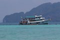 Boat with snorkelers by a reef off the island of Koh Kradan in southern Thailand Royalty Free Stock Photo