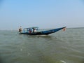 A boat with some tourists sailing parallel to ours in Chilika Lagoon, Odisha, India