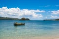 Wooden boat on clear water of Pacific Ocean, beautiful seascape