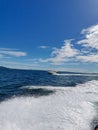 boat speeding on the surface of the sea water