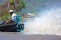 Boat and spray on lake Inle, Myanmar