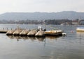 Boat stand with pedalos, on lake zurich, in cloudy weather nobody wants to go boating on the lake, by day, without people Royalty Free Stock Photo