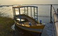 A boat standing in a lake captured during sunrise