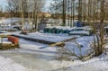 A boat station closed until spring on the banks of the Izhora River in Kolpino, St. Petersburg Royalty Free Stock Photo