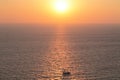 A boat at sunset, island in the Mediterranean