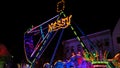 Boat swing at a funfair by night