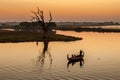 Boat in Taungthaman lake at sunset in Mandalay.