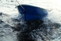 Boat is tethered behind fishing schooner