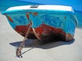 Boat tied by a metal chain on the sand Royalty Free Stock Photo