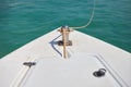 Boat is tied with a rope to the pier. View of the fore deck of the boat