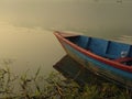 Boat tied to the shore of Fewa Lake