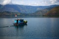 A Boat and Toba Lake Mountain View, Samosir Island, North Sumatra, Indonesia.