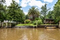 Boat tour on the Parana Delta, Tigre, Buenos Aires, Argentina. Palm trees, construction site of modern brick house