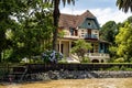 Boat tour on the Parana Delta, Tigre, Buenos Aires, Argentina. Palm trees, construction site of modern brick house