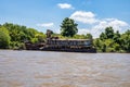 Boat tour on the Parana Delta, Tigre, Buenos Aires, Argentina. Palm trees, construction site of modern brick house