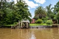 Boat tour on the Parana Delta, Tigre, Buenos Aires, Argentina. Palm trees, construction site of modern brick house