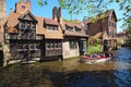 Boat with tourists. Beautiful canal and old, traditional houses in the town of Bruges Royalty Free Stock Photo