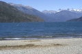 boat for tourists sailing on lake puelo in the province of chubut , in the background the cordillera de los andes