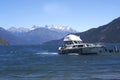 boat for tourists sailing on lake puelo in the province of chubut , in the background the cordillera de los andes