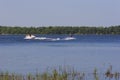 Boat Tows Waterskier on Bass Lake  703471 Royalty Free Stock Photo