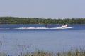 Boat Tows Waterskier on Bass Lake  703469 Royalty Free Stock Photo