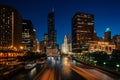 Boat traffic on the Chicago River at night, in Chicago, Illinois Royalty Free Stock Photo