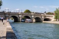Boat traffic under the Pont Neuf - Paris, France