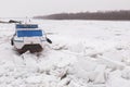 Boat trapped in the frozen Danube river