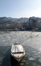 Boat trapped in ice lake Royalty Free Stock Photo