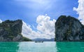 Boat traveling pass canyon mountains on a great lake in Thailand Royalty Free Stock Photo