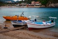 Boat trip along a river in Corfu Greece. Ship on clean blue water. Island houses on the shore view. Greek beautiful