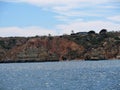 Sandy beaches tucked away between eroded limestone cliffs in southern Portugal Royalty Free Stock Photo