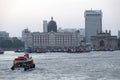 Taj Mahal hotel, Gateway of India and tourist boats in water of Arabian Sea in Mumbai Royalty Free Stock Photo