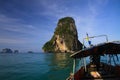 Boat Trip to islands along steep cliffs in blue Andaman Sea near Ao Nang, Krabi, Thailand