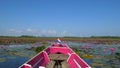 Boat trip to the sea of red lotus, Phatthalung, Thailand