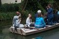 Boat trip tourism on water with smiling people taking photo at little Venise quarter