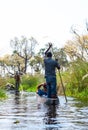 Boat trip in a traditional Makoro at the Okavango Delta, Botswana Royalty Free Stock Photo