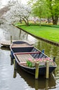 Boat with tulips on water canal in Keukenhof garden park from Netherlands Holland