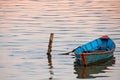 Boat in twilight water of Phewa Lake